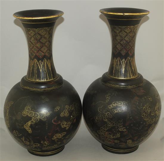 A pair of Chinese gilt and polychrome decorated black lacquer bottle vases, early 20th century, 44cm